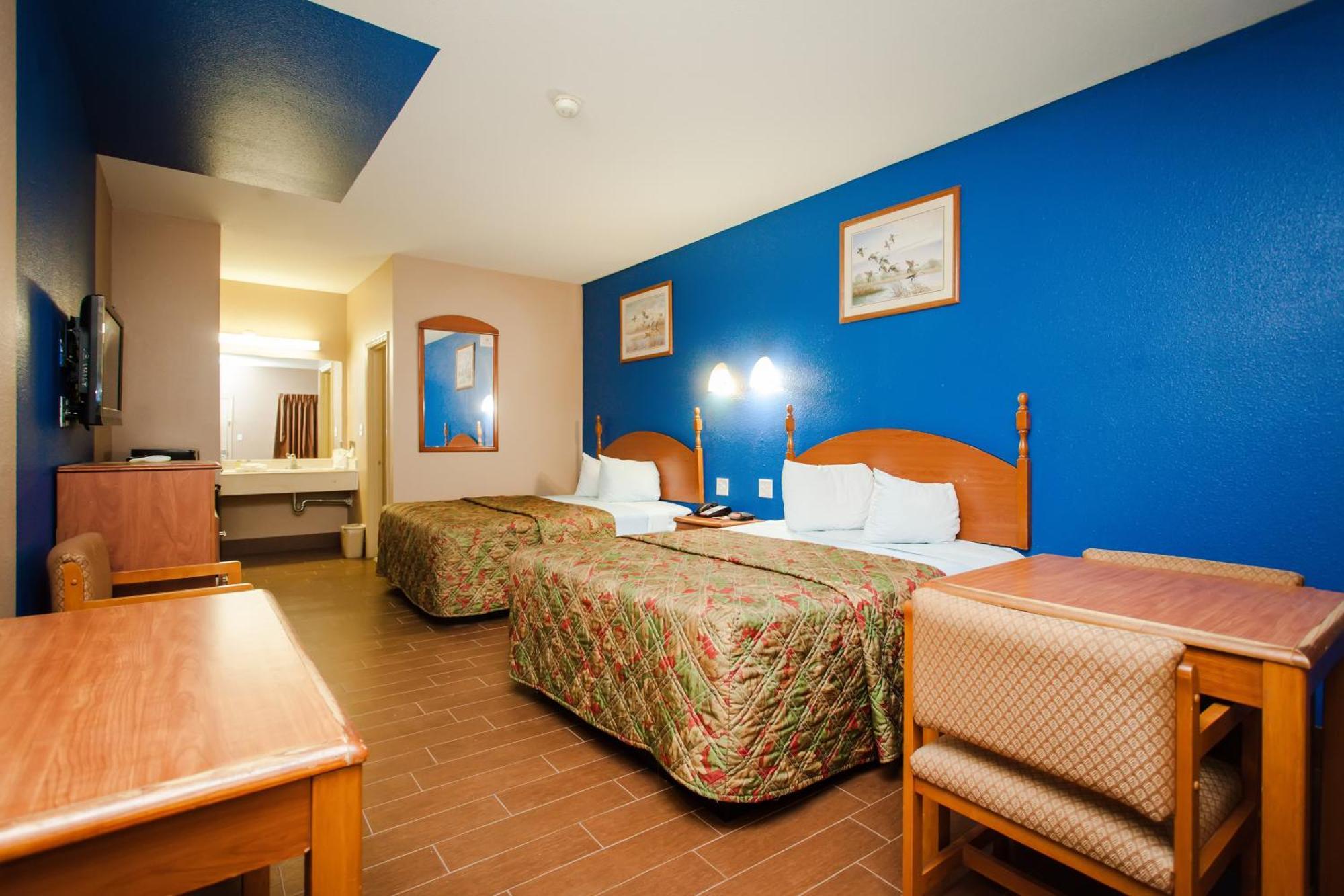 Scottish Inn & Suites Hankamer Chambre photo